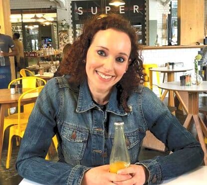 Lila Bruk smiling at a café